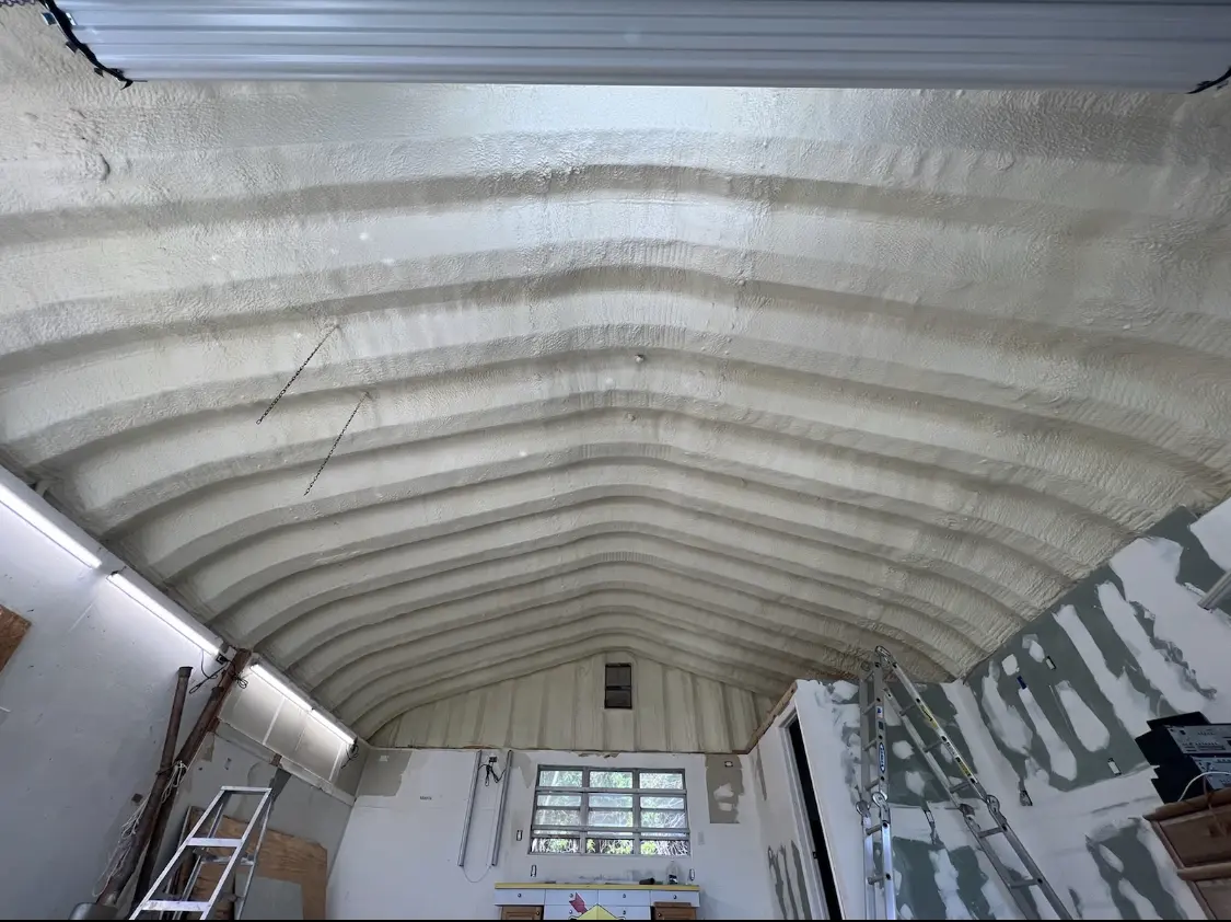 Spray polyurethane foam applied to the underside of a metal roof deck in Redland
